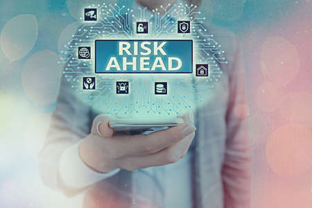 Conceptual hand writing showing Risk Ahead. Concept meaning A probability or threat of damage, injury, liability, loss System administrator control, gear configuration settingsの写真素材