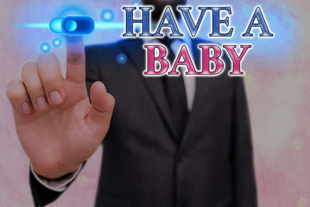Conceptual hand writing showing Have A Baby. Concept meaning parents are expecting or going to have a newborn child Graphics padlock for web data security application systemの写真素材