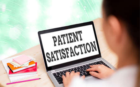 Handwriting text writing Patient Satisfaction. Conceptual photo the extent to which a patient is happy with their healthcare Modern gadgets with white display screen under colorful bokeh backgroundの写真素材