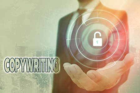 Handwriting text Copywriting. Conceptual photo writing the text of advertisements or publicity material Graphics padlock for web data information security application systemの写真素材