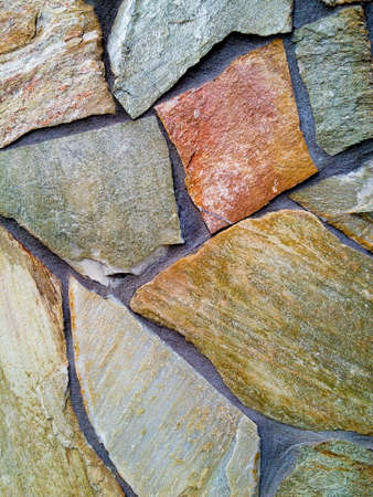 close up of old dark stone wall or surface. background and texture conceptの写真素材
