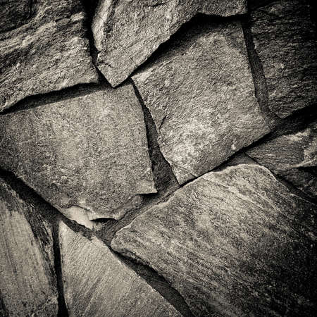 close up of old dark stone wall or surface. background and texture conceptの写真素材