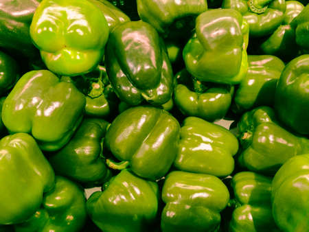green bell peppers in the supermarket, vegetables backgroundの写真素材