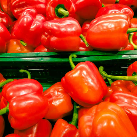 red bell peppers in the supermarket, vegetables backgroundの写真素材