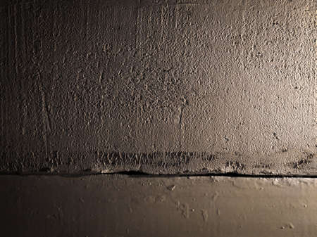 close up of old dark stone wall or surface. background and texture conceptの写真素材