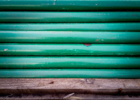 stack of green steel pipes, industrial background, concrete drainage pipes for constructionの写真素材