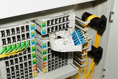 fiber optic cable management system with green and blue SC connectorsの写真素材