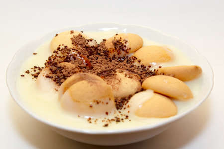pudding with biscuit and granulation cacao on whiteの写真素材
