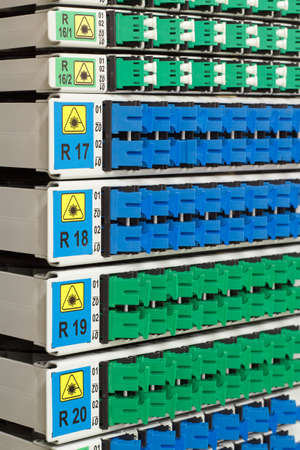 fiber optic cable management system with green and blue SC connectors