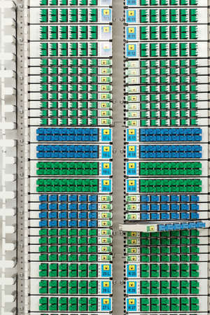 fiber optic cable management system with green and blue SC connectors