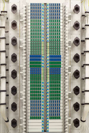 fiber optic cable management system with green and blue SC connectors