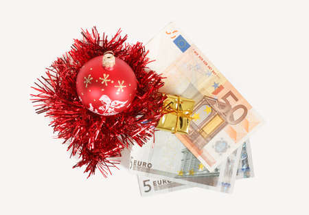 money concept with euro banknotes for christmas gifts on white backgroundの写真素材