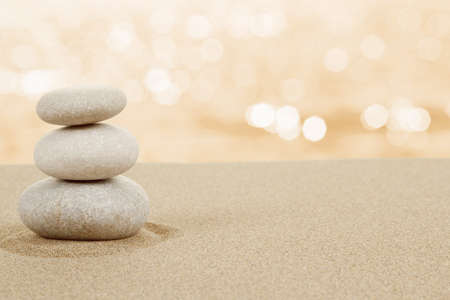 Balance zen stones in sand on white background Balance zen stones in sand on white background