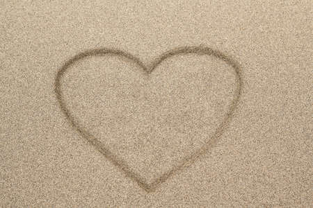 Heart shape drawn in sand for natural, symbol,tourism,holiday or conceptual designs の写真素材