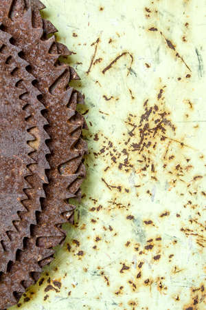 detail of old hanged rusted circular saw bladesの写真素材