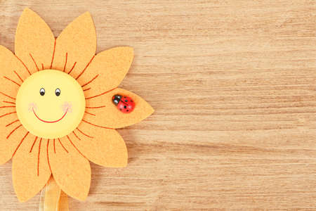 wooden board for spring message with two red hearts and flowersの写真素材