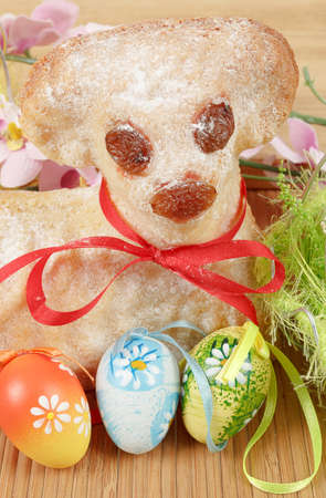 Easter lamb with painted eggs and easter decorationsの写真素材