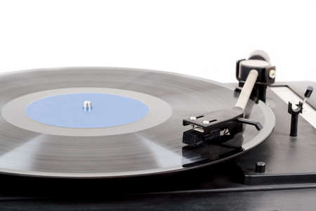 Spinning vinyl record. Motion blur image.  Vintage toned. Shallow depth of field.