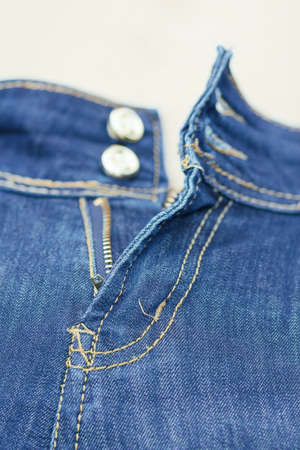 zip on blue jeans with shallow focusの写真素材
