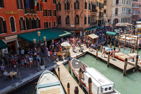 ITALY, VENICE - JULY 2012: Crowd of tourist near Grand Canal on July 16, 2012 in Venice. More than 20 million tourists come to Venice annually. のeditorial素材