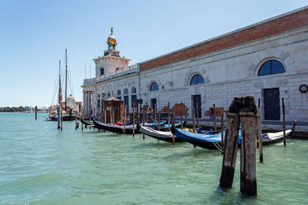 ITALY, VENICE - JULY 2012: Floating at Grand canal on July 16, 2012 in Venice. The canal forms the major water-traffic corridors in the city. のeditorial素材