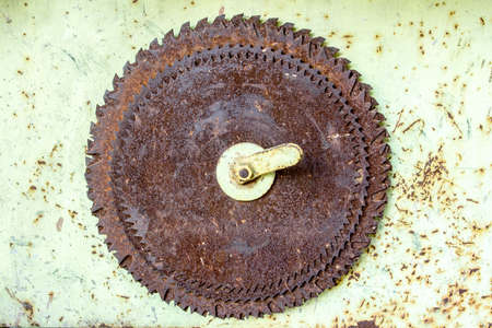 detail of old hanged rusted circular saw bladesの写真素材