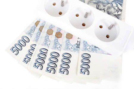 power cord and banknotes of czech crowns money concept of expensive energy bill