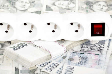 power cord and banknotes of czech crowns money concept of expensive energy billの写真素材