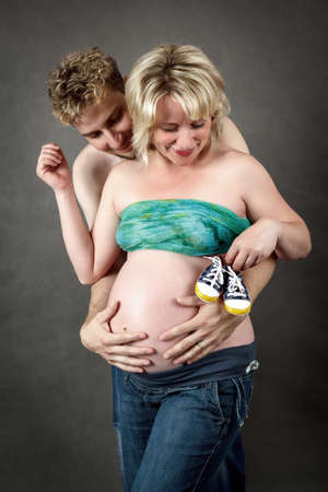Loving happy couple, pregnant woman with her husbandの写真素材