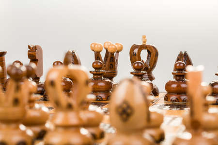 chess board focus to back king and queen on white backgroundの写真素材
