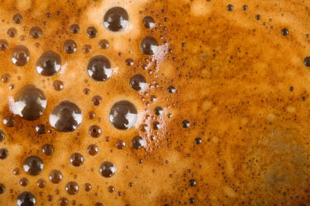texture of freshly brewed coffee and milk with foam and bubblesの写真素材
