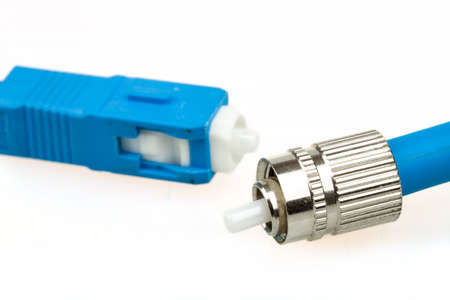 blue fiber optic SC connector and FC type connector on white backgroundの写真素材