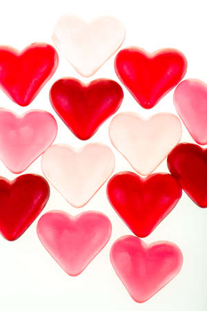 Brightly coloured red gums hearts as valentine present isolated on white background