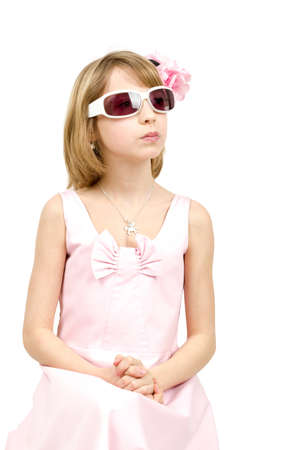 Studio portrait of young beautiful girl with sun eyeglasses on white backgroundの写真素材