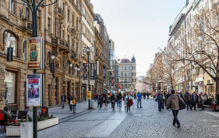 PRAGUE, CZECH REPUBLIC - MARCH 13th, 2014 - Prague shops situated in historic center near Wenceslas square with tourists.のeditorial素材
