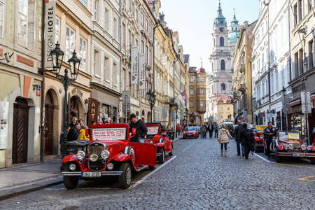 PRAGUE, CZECH REPUBLIC - MARCH 13th, 2014 - Famous historic red car Praga in Prague street. Praga is a manufacturing company founded in 1907 based in Prague, Czech Republic.のeditorial素材