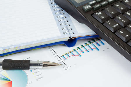 businessman workplace with money, coins, pen and calculatorの写真素材