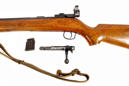 detail of old bolt action rifle isolated on white background