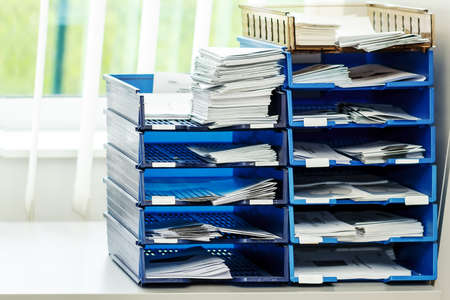 documents and projects file folders on the shelves at officeの写真素材