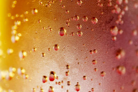 color macro of sparkle water drops on dewy glass for background or backdropの写真素材