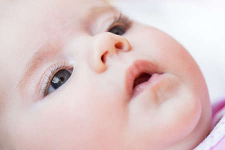 macro of adorable baby girl eye with shallow focusの写真素材