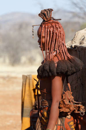 NAMIBIA, KAMANJAB, OCTOBER 10: Himba tribe woman with ornaments on the neck, in the village of Himba people near Kamanjab in northern Namibia, August 10, 2014, Namibiaのeditorial素材