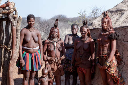 NAMIBIA, KAMANJAB, OCTOBER 10: Himba and Zemba tribe woman with ornaments on the neck, in the village of Himba people near Kamanjab in northern Namibia, August 10, 2014, Namibiaのeditorial素材