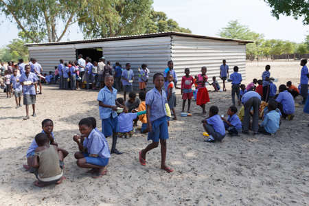 NAMIBIA, KAVANGO, OCTOBER 15: Happy Namibian school children waiting for a lesson. Kavango was the region with the highest poverty level in Namibia, more than 50% of the population were classified as poor. October 15, 2014, Namibiaのeditorial素材