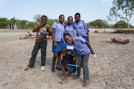 NAMIBIA, KAVANGO, OCTOBER 15: Happy Namibian school children waiting for a lesson. Kavango was the region with the highest poverty level in Namibia, more than 50% of the population were classified as poor. October 15, 2014, Namibiaのeditorial素材