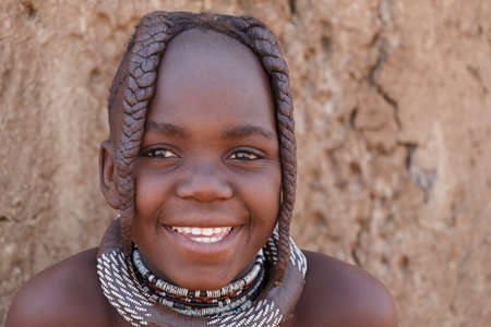 NAMIBIA, KAMANJAB, OCTOBER 10: Unidentified child Himba tribe. The Himba are indigenous peoples living in northern Namibia, in the Kunene region of South-West Africa on october 10 2014のeditorial素材
