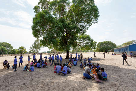 NAMIBIA, KAVANGO, OCTOBER 15: Happy Namibian school children waiting for a lesson. Kavango was the region with the highest poverty level in Namibia, more than 50% of the population were classified as poor. October 15, 2014, Namibiaのeditorial素材