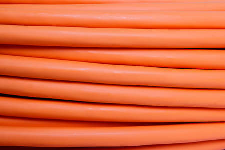 detail of multimode orange fiber optic cable background