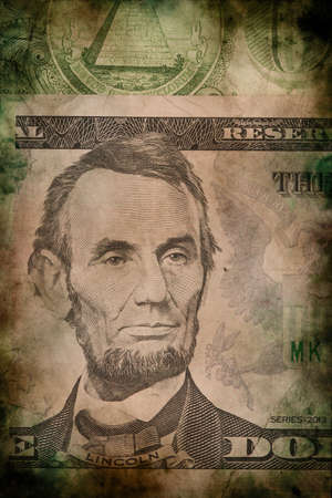 Macro of Abraham Lincoln on five USA one dollar banknote grunge vintage style