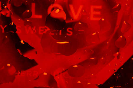 red abstract background with water drops on glass for background or backdropの写真素材